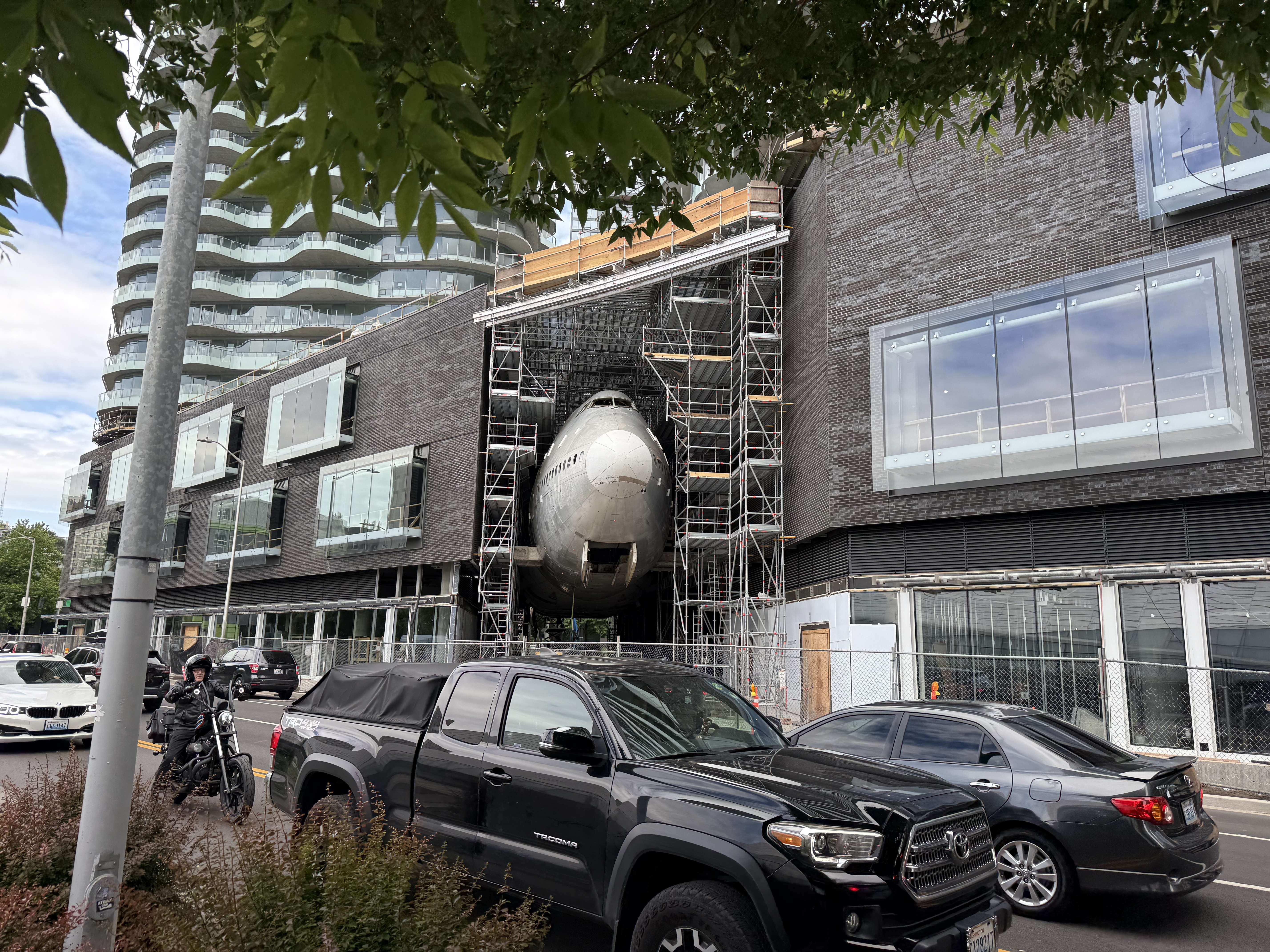 A strange building in Seattle with a partial plane sticking out of it.